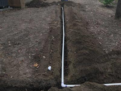 Trenched piping dark soil