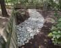 Dry creek bed installed in back yard to aid in drainage